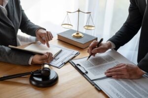 Lawyer or legal advisor reviewing business contract details, ensuring accuracy in legal documents during a brainstorming session.