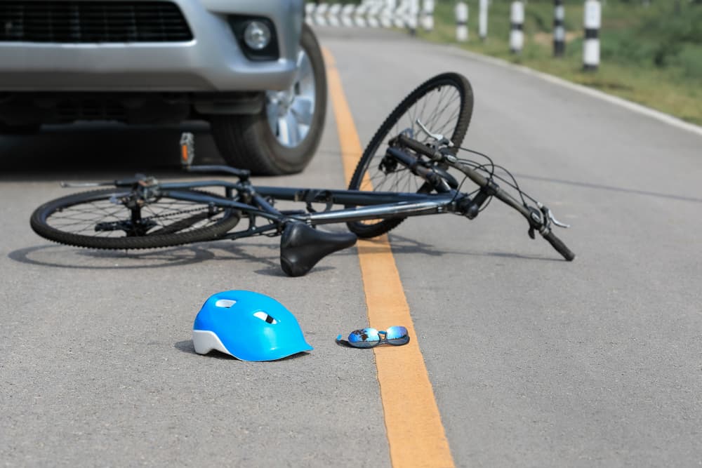 Accident car crash with bicycle on road